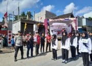 Bhabinkamtibmas Mekar Damai Amankan Jalur Gerak Jalan, Sukseskan Peringatan HUT RI ke-80