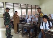 Bhabinkamtibmas dan Babinsa Desa Bujak Kawal Ketat Distribusi 3.064 Porsi Makanan Bergizi Gratis untuk Pelajar.