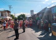 Personel Polsek Madapangga Gelar Pengamanan Pawai Ta,aruf MTQ Tingkat Desa Bolo Tahun 2026