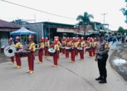 Bhabinkamtibmas Polsek Madapangga Kawal Pawai Ta’aruf Pembukaan MTQ Tingkat Desa Dena